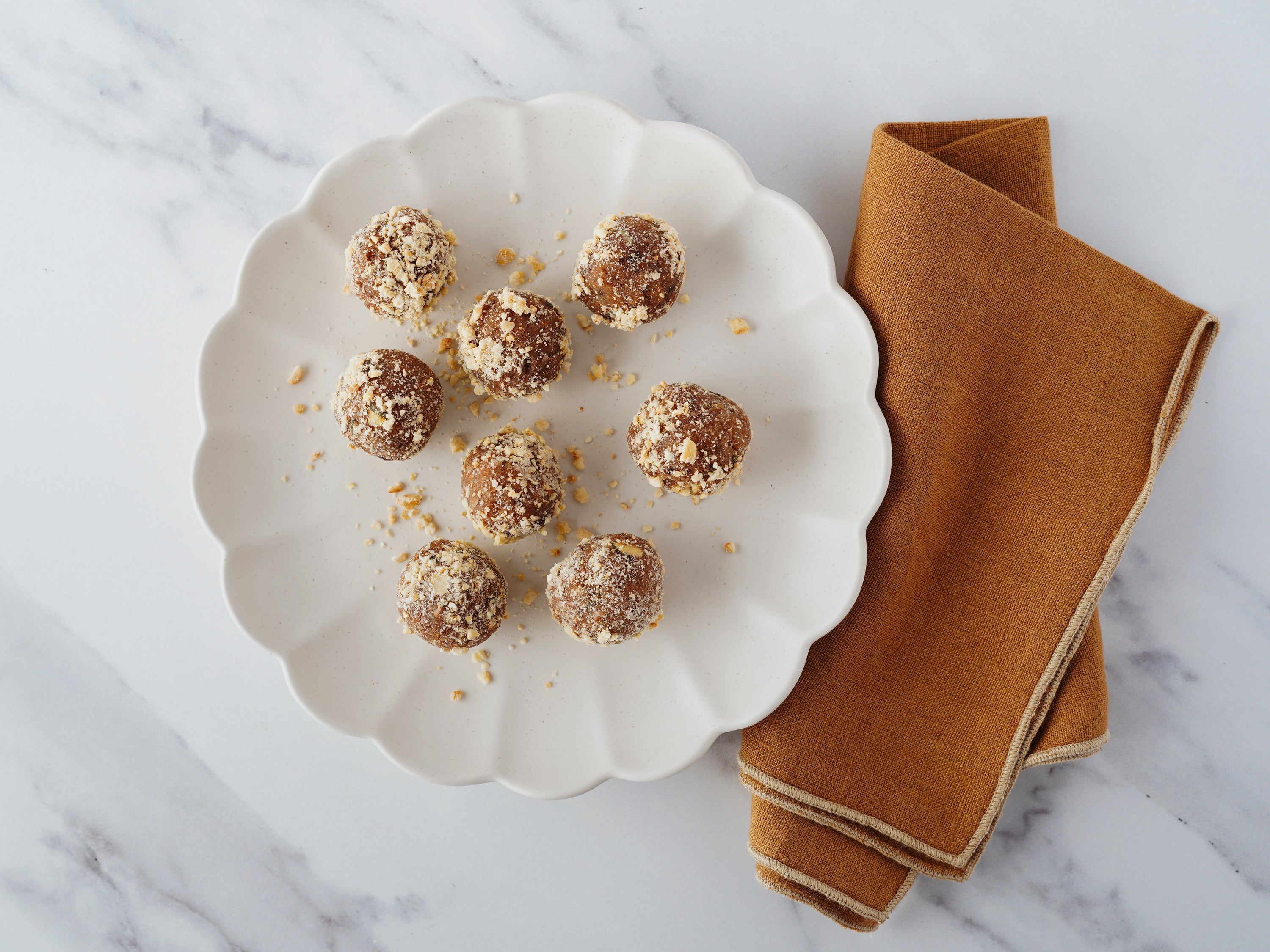 Almond butter keto bombs rolled in cashew crunch